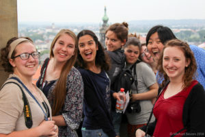 A photo of Houghton students posing overseas