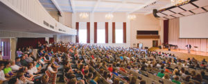 a photo of the lecture hall filled with students