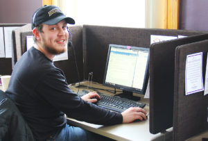 a photo of Duncan at a computer